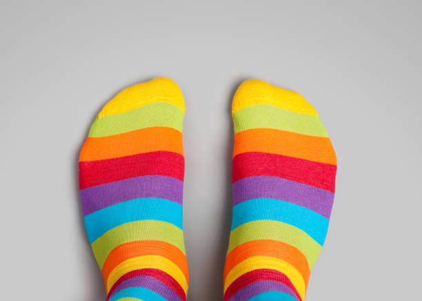 istock Foot in rainbow colors socks on grey background 932212714