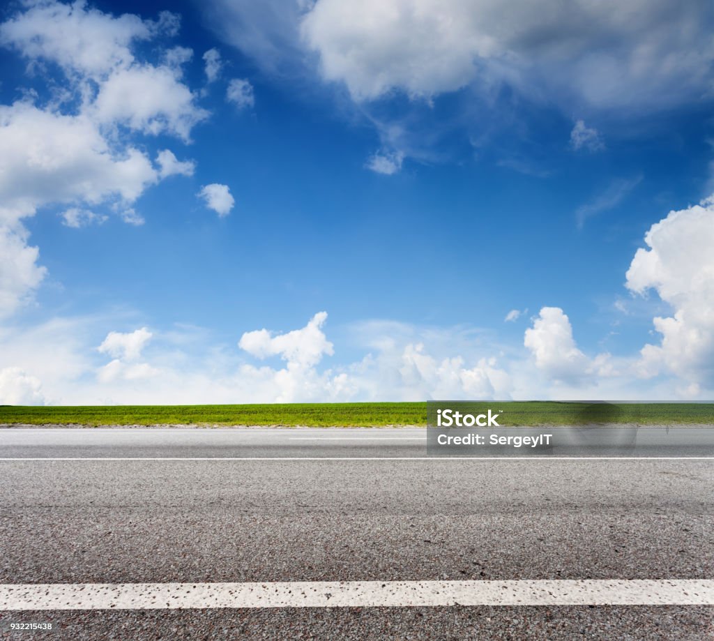 Asphalt road and blue sky, side view Landscape in summer day Side View Stock Photo