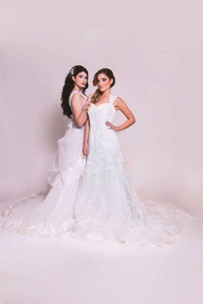 istock Wedding - beautiful double young  bride with a soft and white dress 932216942