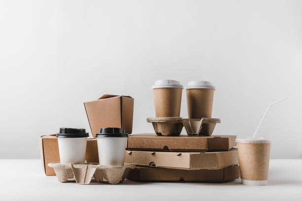 istock pizza boxes and coffee to go with take away boxes on tabletop 932240768