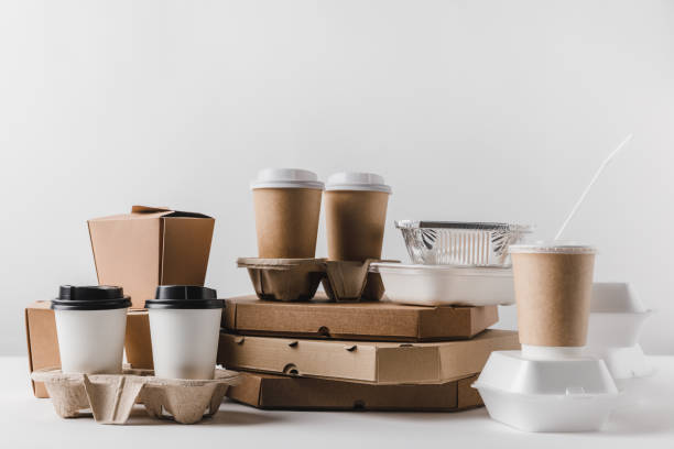 istock pizza boxes and coffee in paper cups with wok boxes on tabletop 932241158