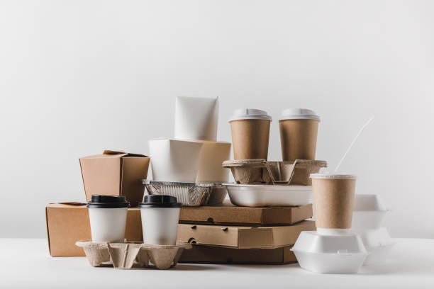 istock pizza boxes and disposable coffee cups with take away boxes on tabletop 932241280