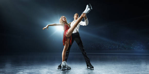 istock Figure skating. Ice skaters couple 932241612