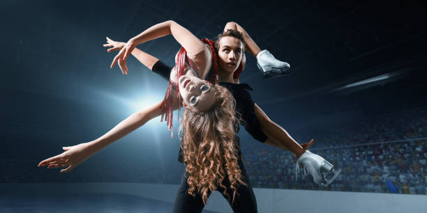 istock Figure skating. Ice skaters couple 932241732