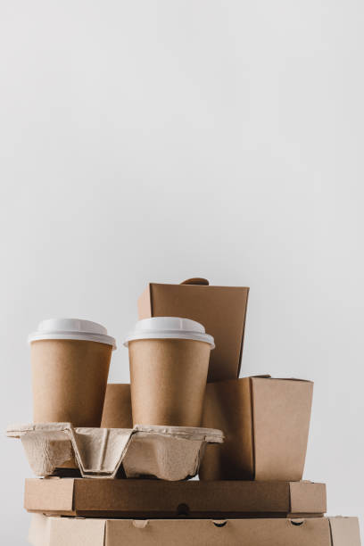 istock pizza boxes and disposable coffee cups isolated on white 932241968