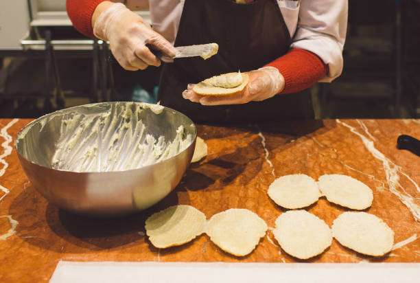 istock Midsection Of Male Chef Preparing Food On Table 932251842