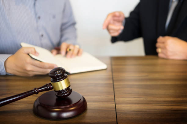istock Cropped Hands Of Business People Discussing Over Documents At Table In Office 932252304