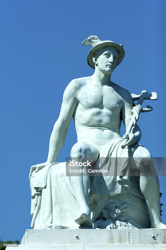 A light blue statue of Hermes, outside on a clear day Statue of the Greek god of trade, Hermes, located in the port of Copenhagen Hermes - Greek God Stock Photo