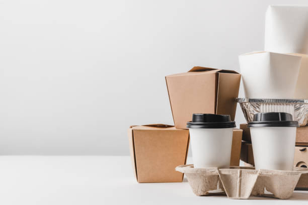 istock fast food in different containers and take away boxes on table 932262354