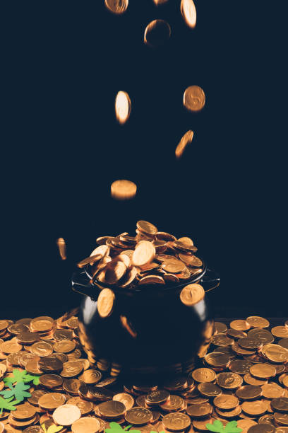 istock golden coins falling in pot, st patricks day concept 932262390