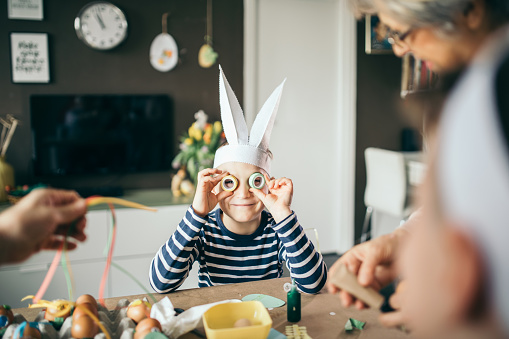 Photo of kids having fun decorating Easter eggs