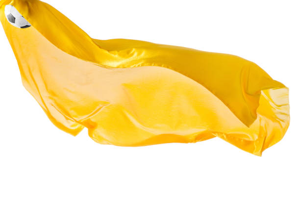 istock Soccer ball and Smooth elegant transparent yellow cloth isolated or separated on white studio background 932262468