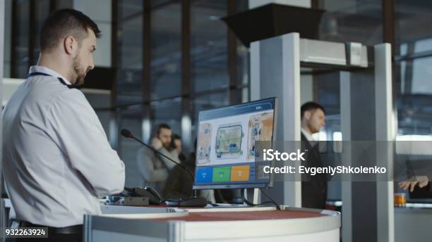 Airport Worker Exploring Xray Of Baggage Stock Photo - Download Image Now - Airport, Security, X-ray Equipment