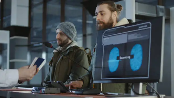 Photo of Airport security processing a thumb print