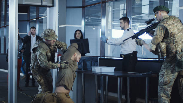 istock Man transitting weapon standing in airport 932264040