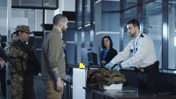 istock Man transitting weapon standing in airport 932264092
