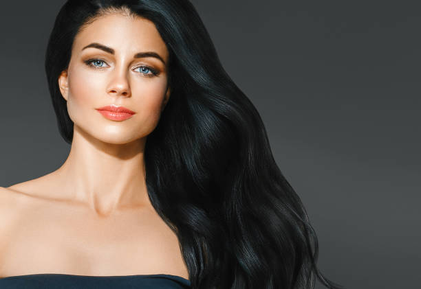 istock Beautiful woman face studio portrait. Beauty black long hair. 932268310