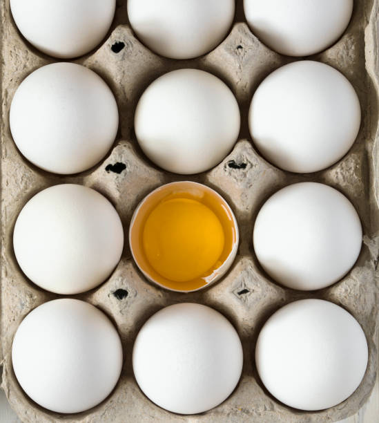istock White raw chicken eggs in carton box 932271238