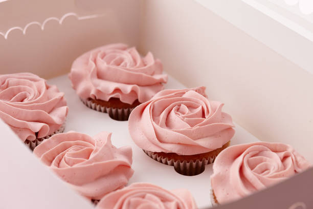 istock Muffins with flower shaped cream in box 932271428