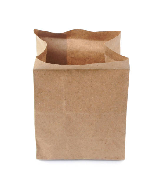 istock An empty brown paper bag isolated on white background. 932271508