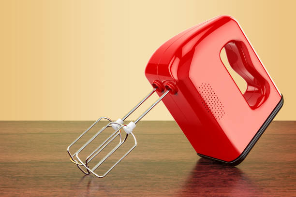istock Red kitchen mixer on the wooden table. 3D rendering 932272656
