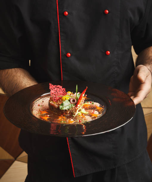 istock Modern restaurant dish. Veal tartare with quail egg 932278550