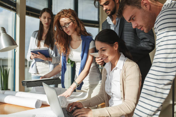 istock Group of business people working on new project . 932278792