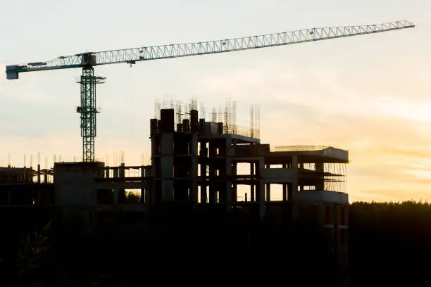 building construction site and crane silhouette