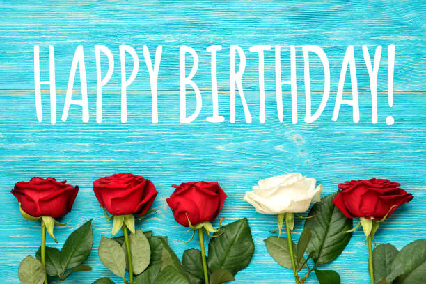 istock happy birthday greeting card with red and white roses 932279508