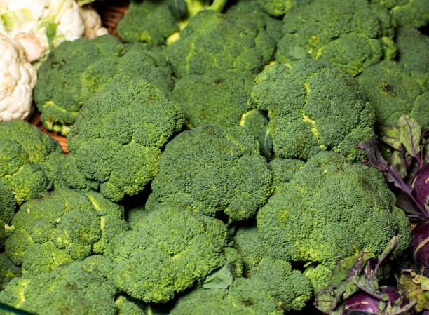 istock Fresh Broccoli in a pile at supermarket. 932281324