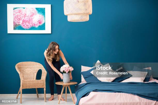 Woman With Flowers At Home Stock Photo - Download Image Now - Decorating, Domestic Life, Bedroom