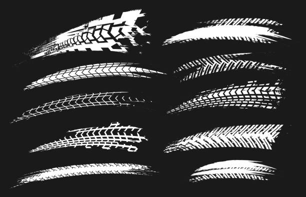 Tire Tracks Elements-03 Motorcycle tire tracks vector illustration. Grunge automotive element useful for poster, print, flyer, book, booklet, brochure and leaflet design. Editable graphic set in white color isolated on a black background. bicycle patterns stock illustrations