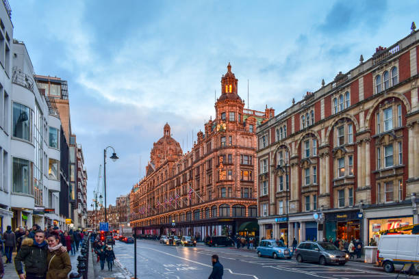 London, UK - 29 December, 2017: Harrods department store against a grey sky. London is the capital city of England in the United Kingdom and plays host to an average of over 18 million tourists per year.