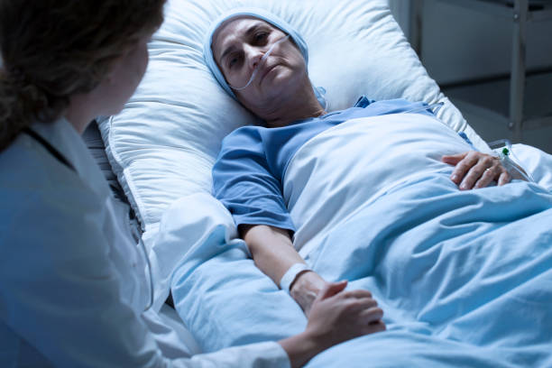 istock Dying woman with nurse 932290316