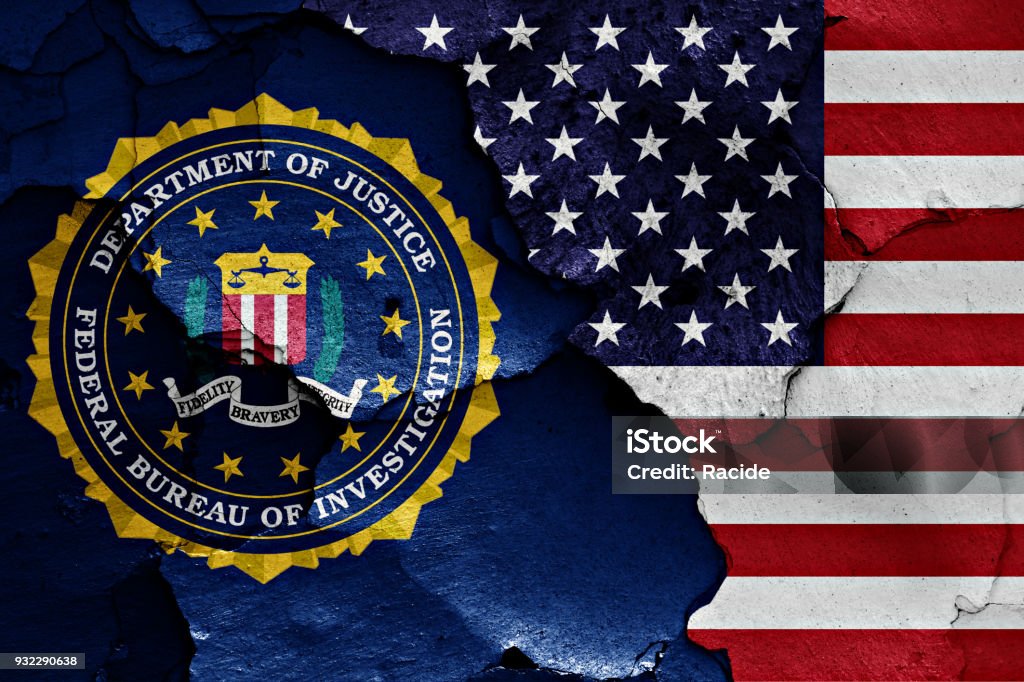 flag of FBI and USA painted on cracked wall FBI Stock Photo