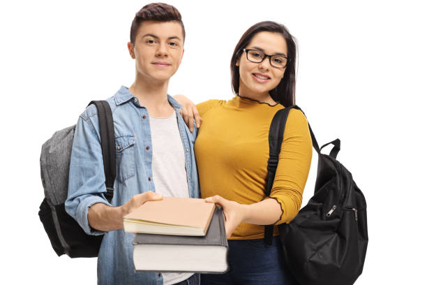 istock Teenage students giving books 932293804