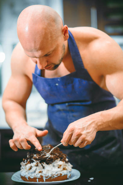 istock A young man is cooking in a large kitchen 932293954