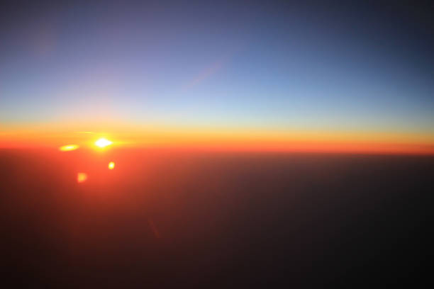 istock the sunset above clouds at the plane 932296940