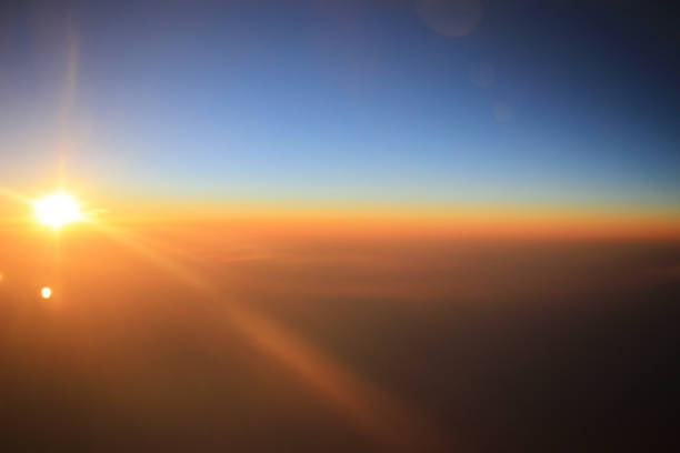 istock the sunset above clouds at the plane 932296966