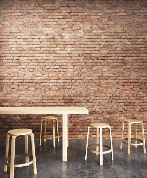 istock Wooden dining table set with orange brick wall background.3D illustration 932296994