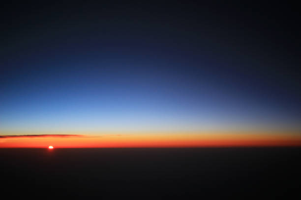 istock the sunset above clouds at the plane 932297008