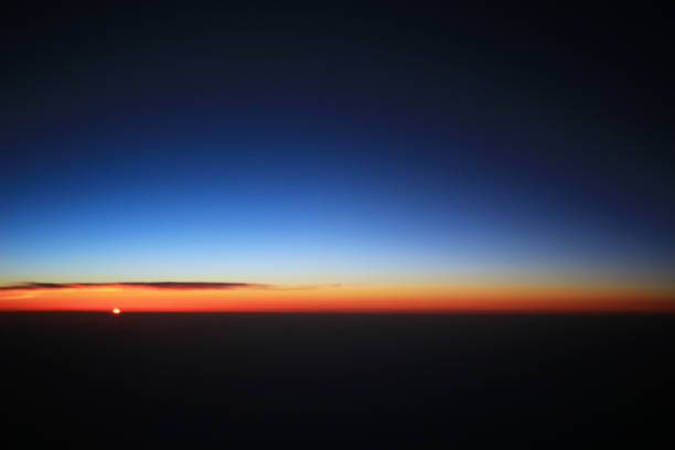 istock the sunset above clouds at the plane 932297054