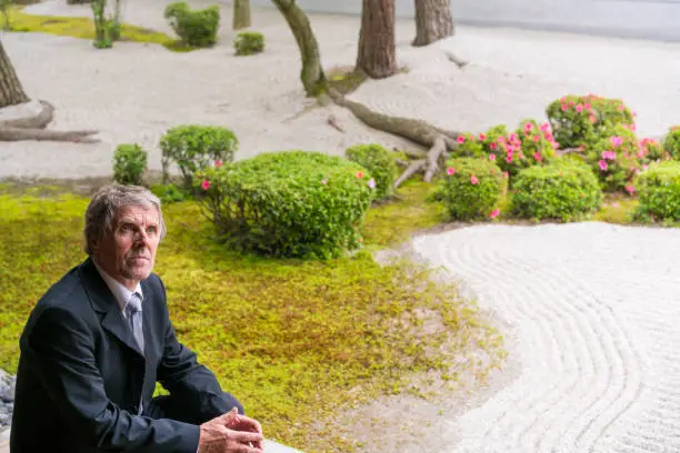 Photo of Man and Zen garden  of Chion-ji temple in Kyoto, Japan