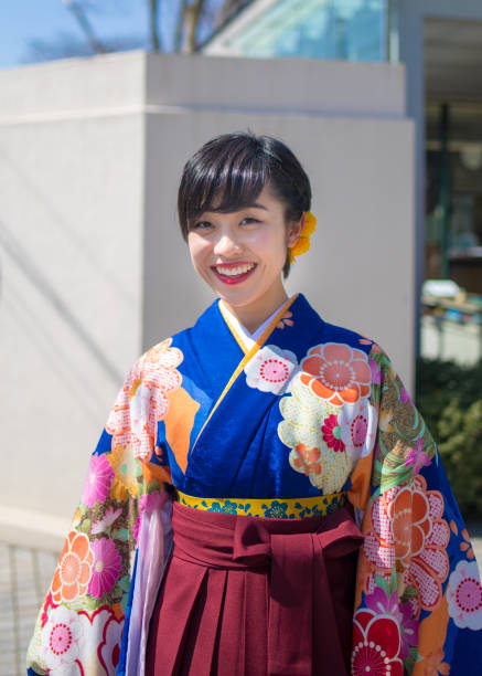 istock Female university student at graduation ceremony 932302150
