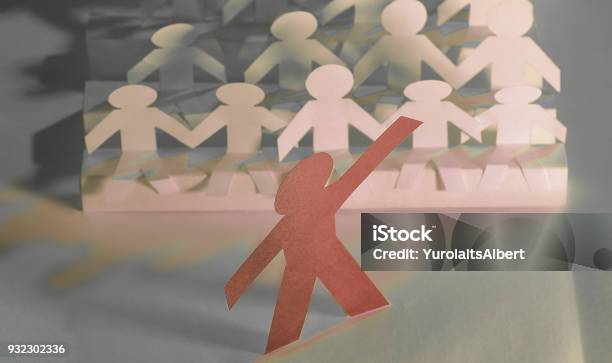 Leader Standing In Front Of A Group Of Paper Doll Stock Photo - Download Image Now - Adult, Adults Only, Advertisement