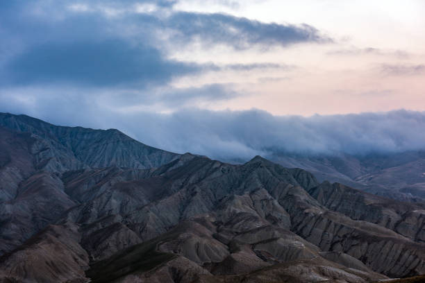 istock Clouds over the majestic mountain peaks 932302966
