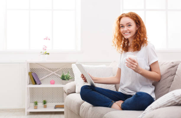 istock Cheerful girl with digital tablet 932307300