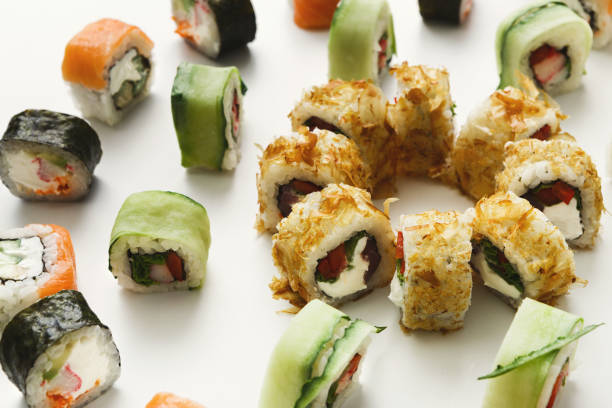 istock Japanese sushi rolls, maki on white background 932310432