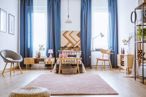istock Grey armchair in bright bedroom 932310538