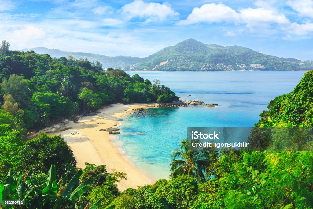 Picturesque view of Andaman sea in Phuket island, Thailand. View through the jungle on the beautiful bay and mountains. Tropical beach Laem Singh. Exotic views through the jungle to uninhabited beach. Blue lagoon. Picturesque bay. Laem sing beach. Phuket Island Stock Photo